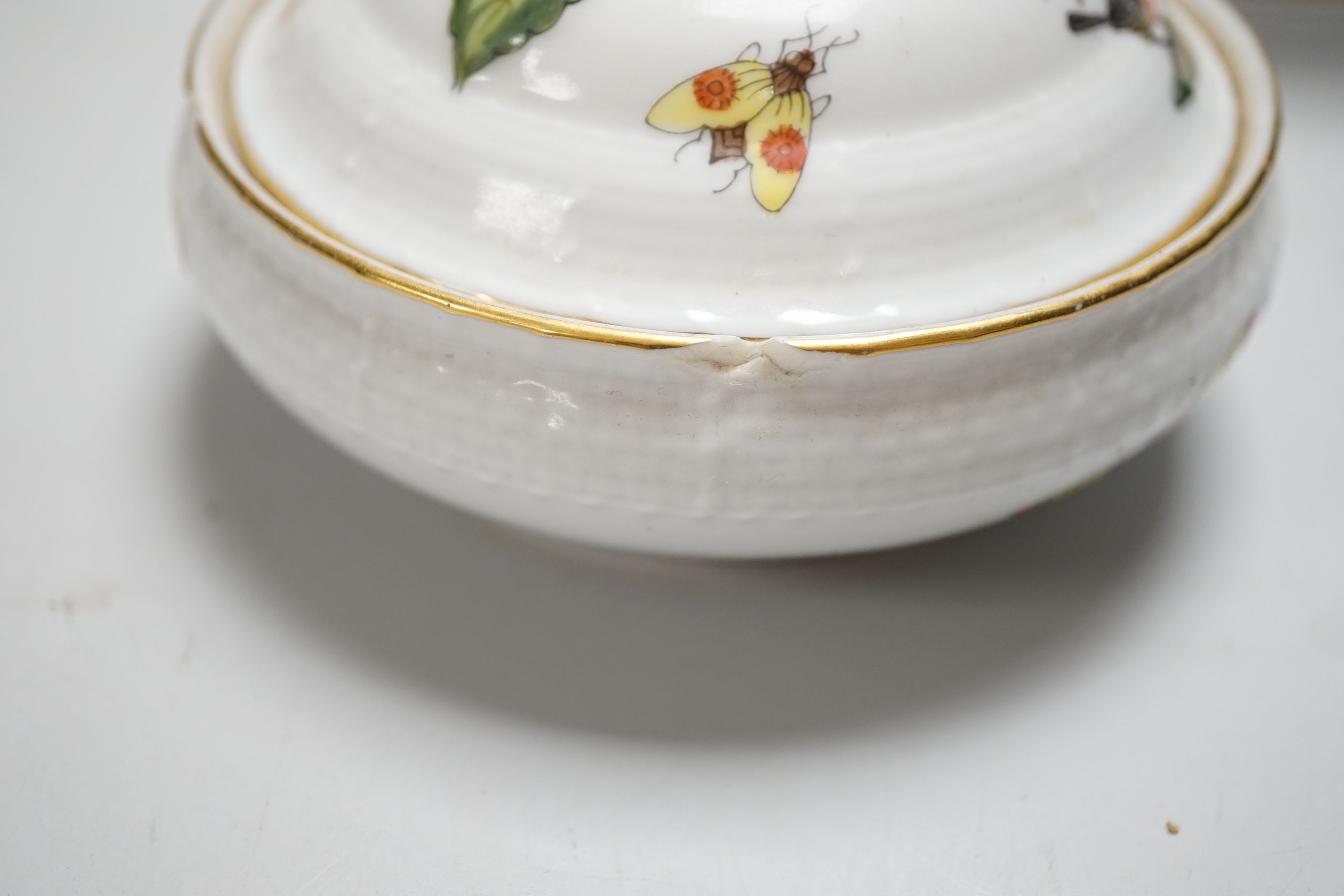 A Herend handpainted pot and cover, a cup and four saucers and teapot decorated with birds and insects and a similar sucrier and cover decorated with fruit